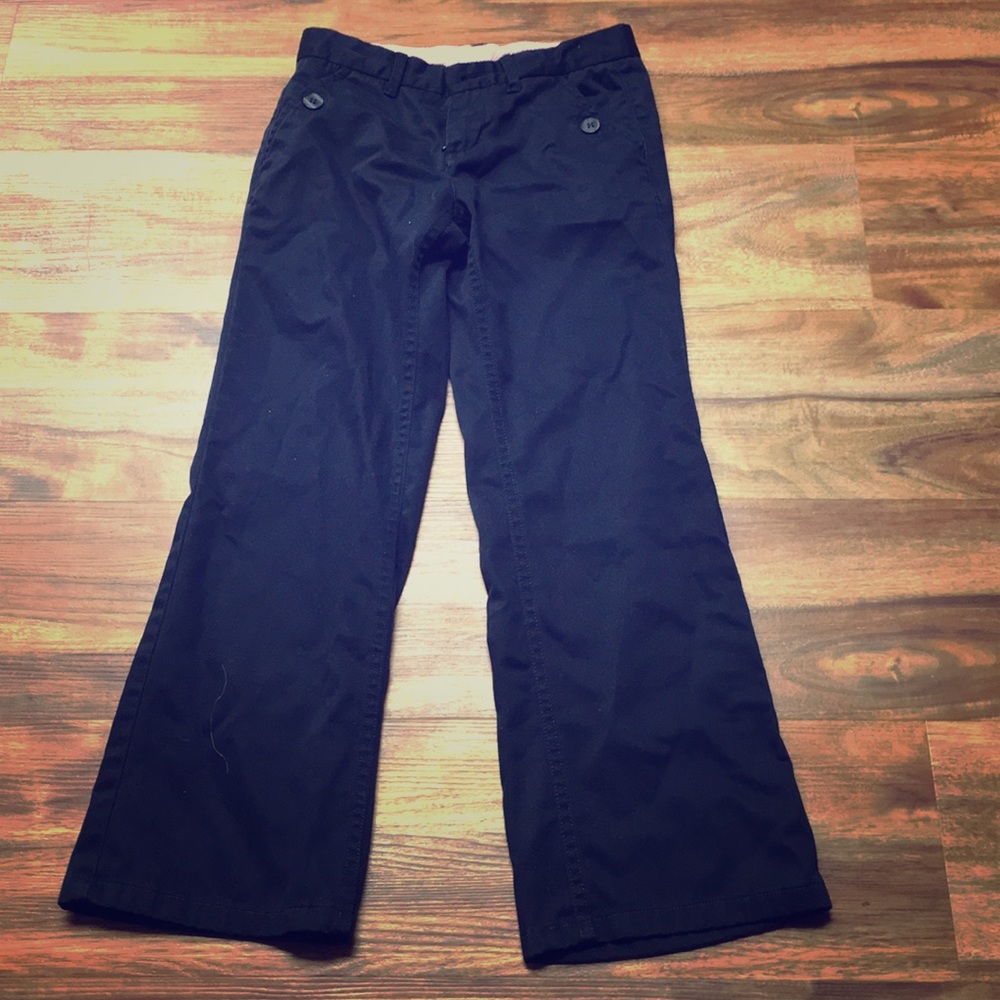 These are some dark blue uniform pants with button
